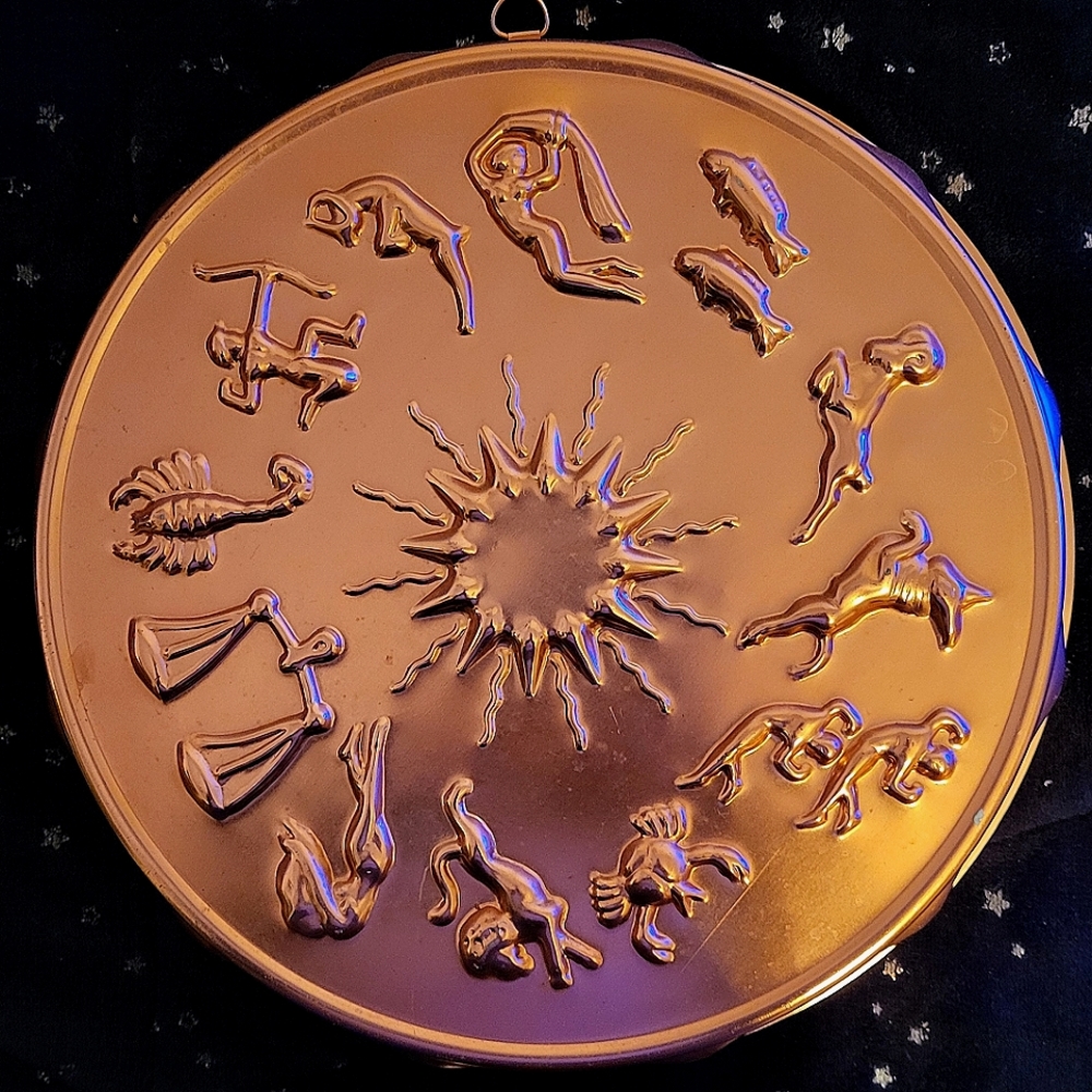 copper cake pan with zodiac, approx 1' wide, 3"deep.